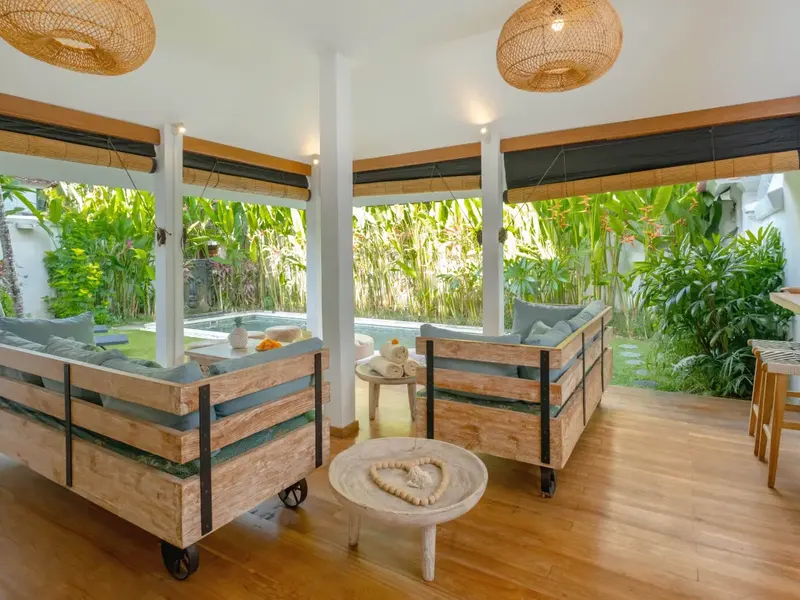 Timber-framed furniture on a hardwood floor in Bali