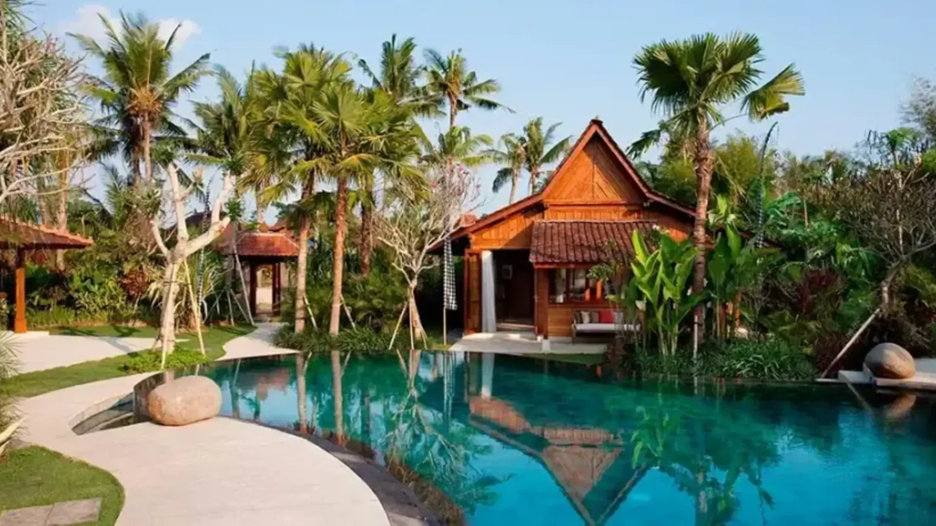 Timber villa beside a pool in Bali